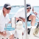 Two men sailing on a boat.